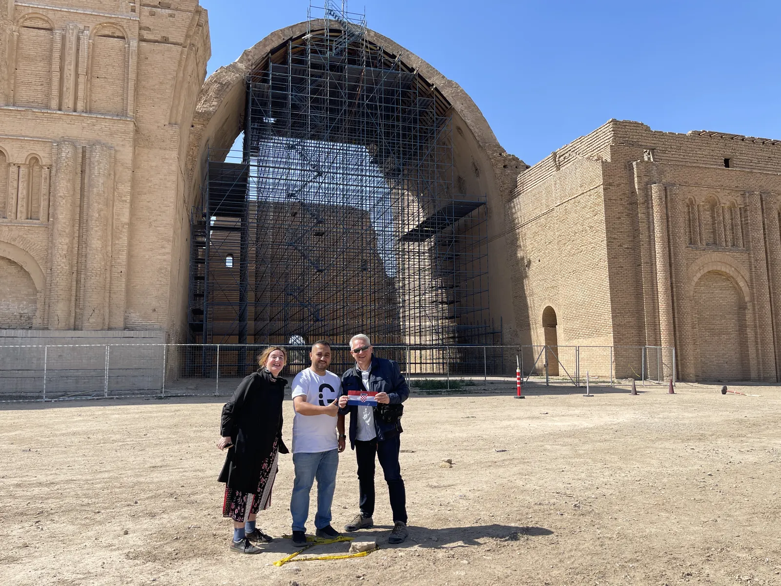Visitors beneath the Taq Kasra arch, Ctesiphon